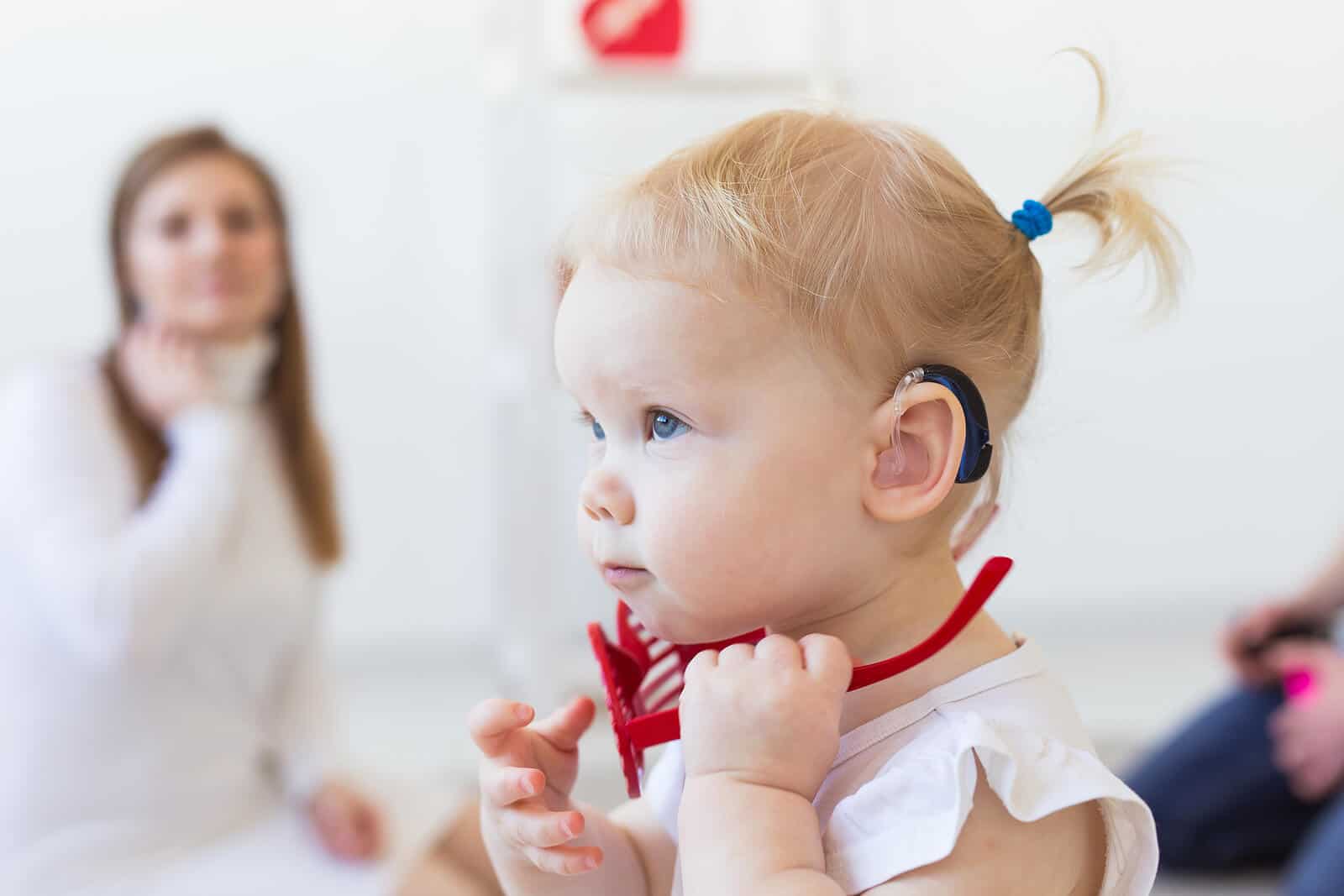 Baby girl wearing hearing aids