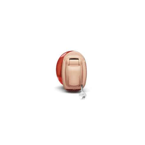 Red and beige Phonak Invisible-In-The-Canal (IIC) hearing aid
